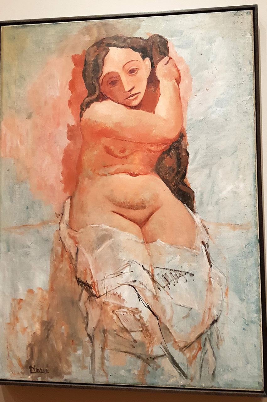 Femme se tressant les cheveux de Pablo Picasso